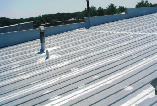 Another wide-shot showing the roof with seams taped and coated.