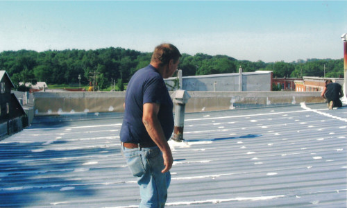 Photo of previous owner and founder Ed Neffe surveying the work.