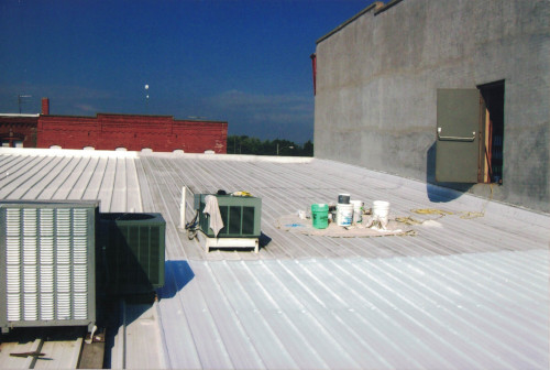 Photo of us finishing the lower roof two years later.