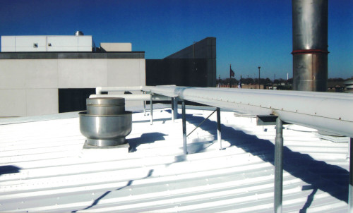 Photo of the previously leaking roof of a food processor in IA.